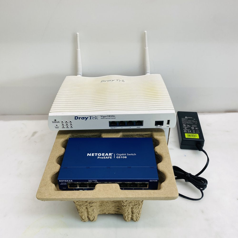 NETGEAR ProSAFE GS108 8-Port Gigabit Switch + DrayTek Vigor2850n Router Grade B